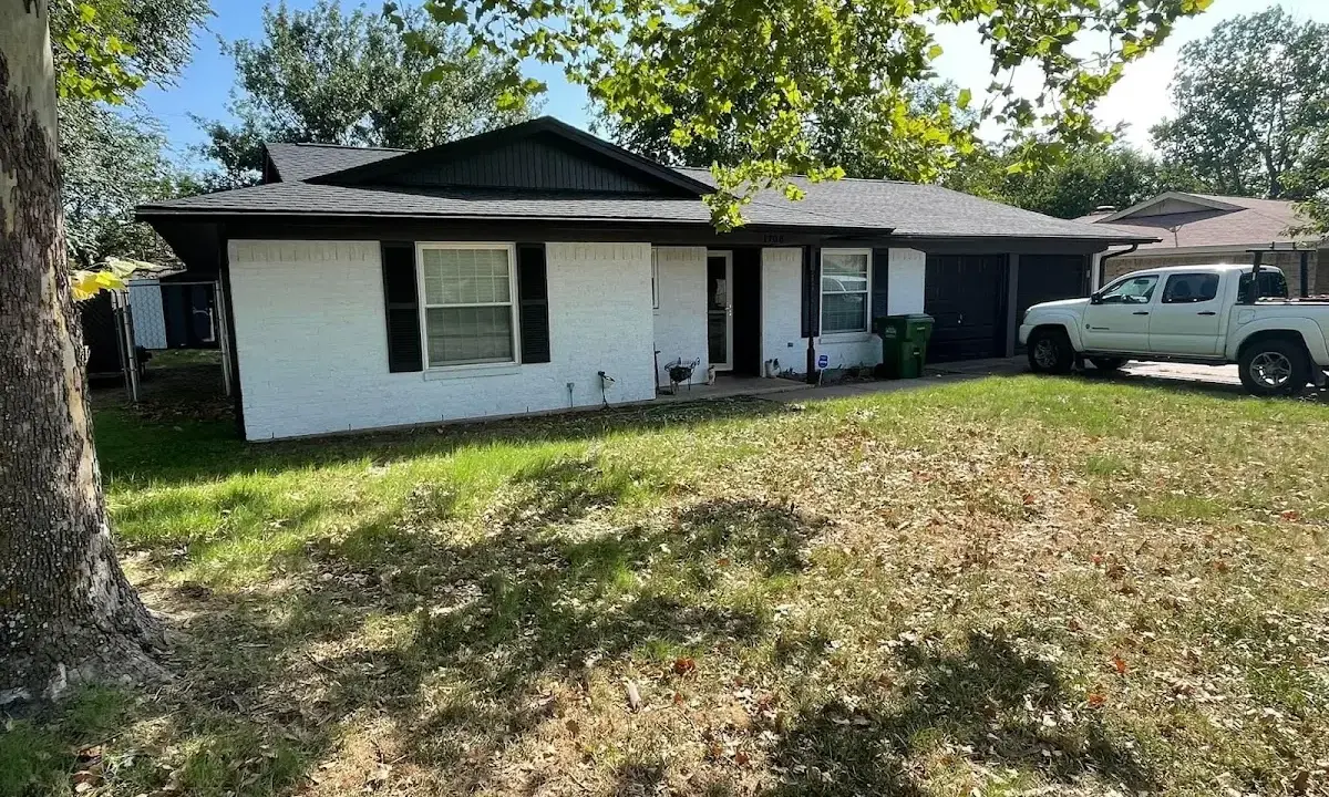 Professional roofing crew working on a residential roof in Middletown